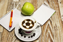 cup-coffee-soccer-ball-pencil-paper-glass-water-green-apple-51868982